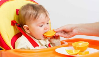 Toddler Eating Oranges