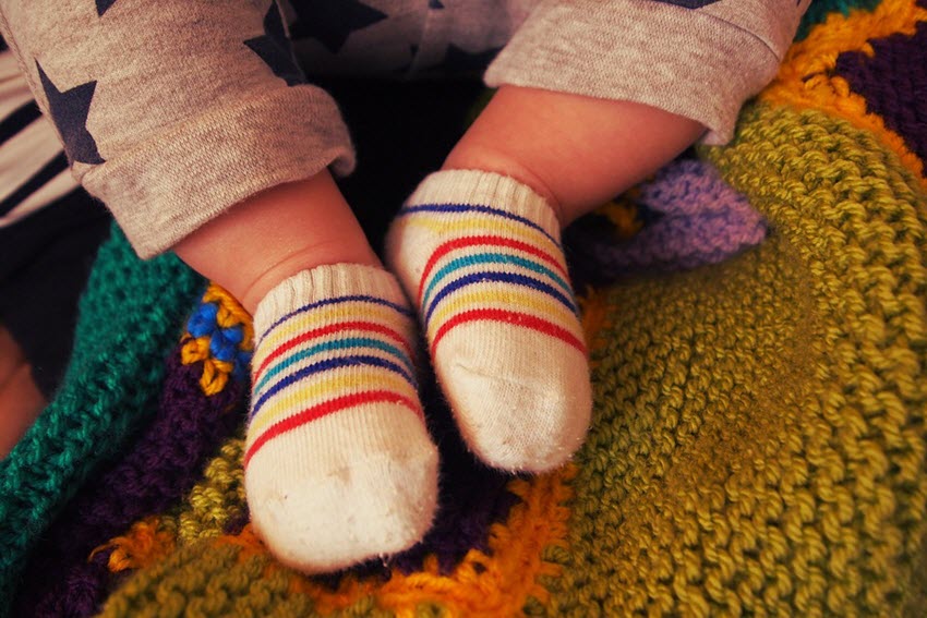 baby wearing socks to keep warm