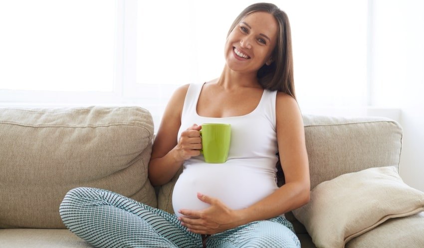 pregnant woman with mug
