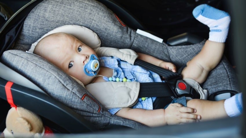 baby boy on infant seat