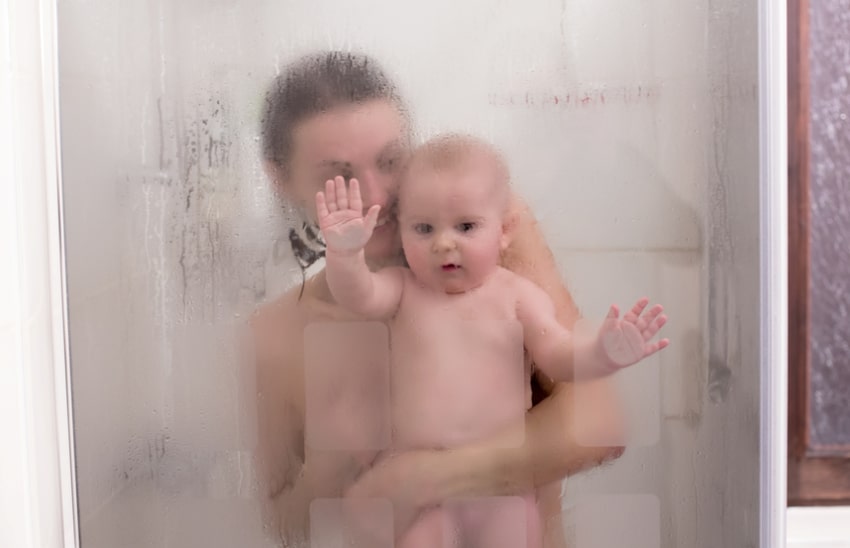 baby with mother in the shower