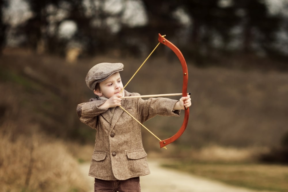 boy with bow and arrow