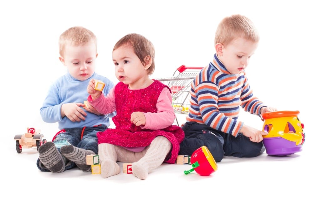 three toddlers playing