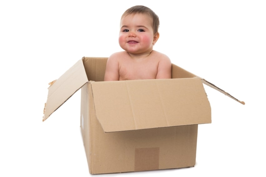 baby in a cardboard box