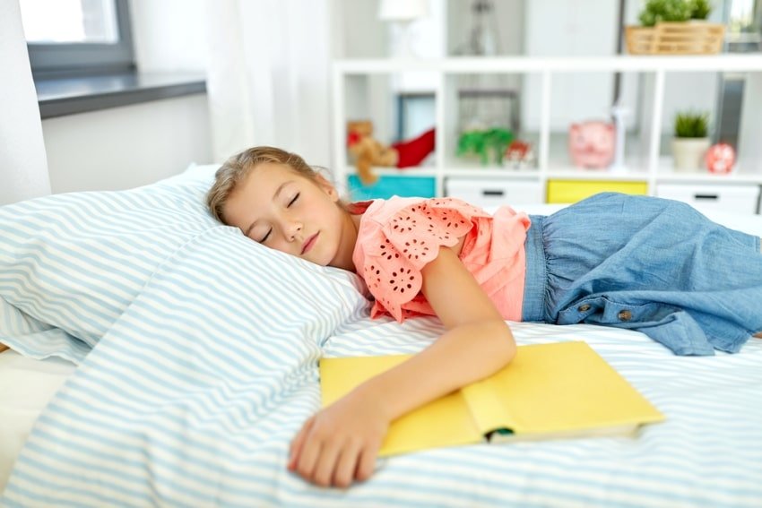 child sleeping in her room