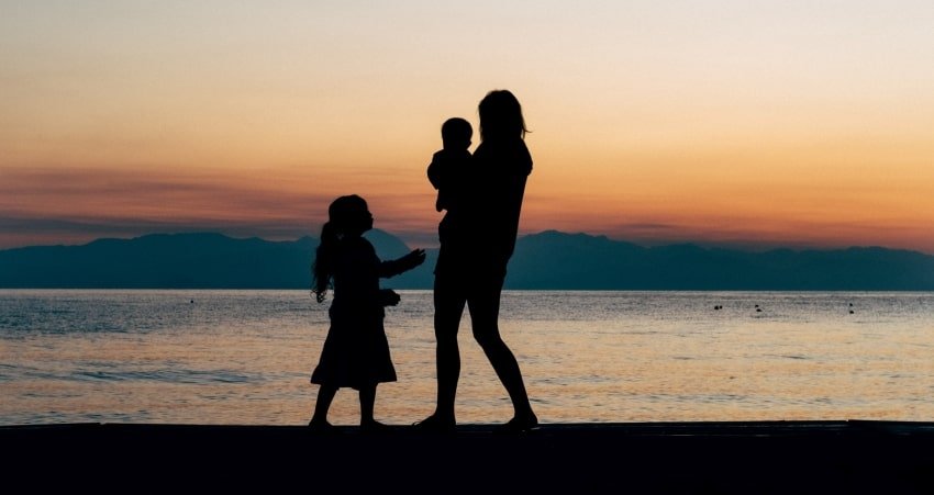 silhouette of woman with kids