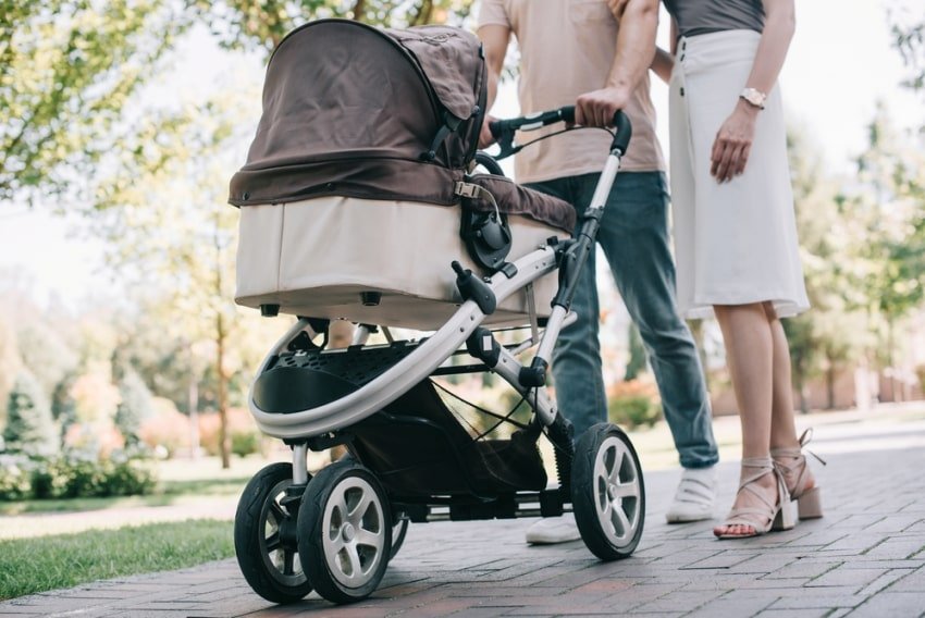 parents with their baby in the stroller