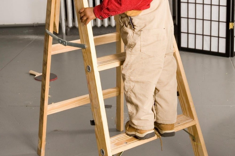 child climbing on a small ladder