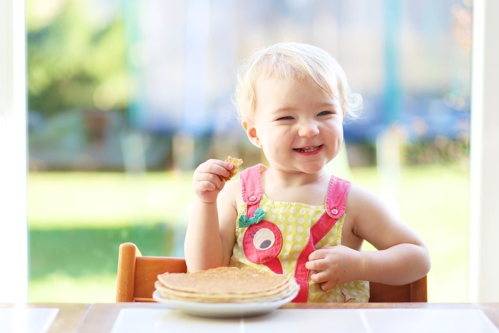 baby eating pancakes