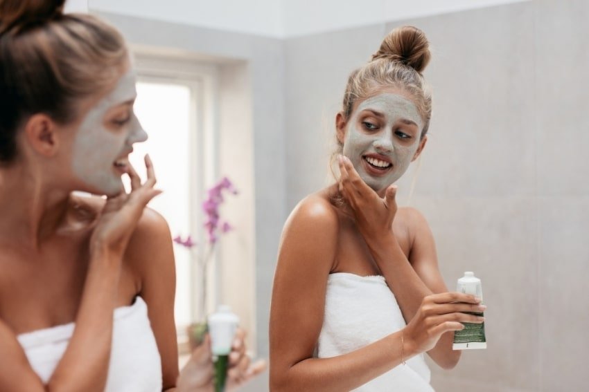 woman adding a face mask
