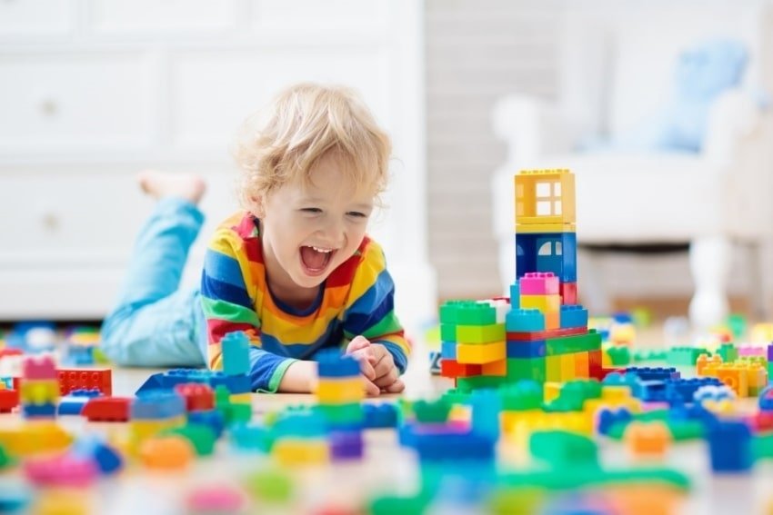 toddler happily playing