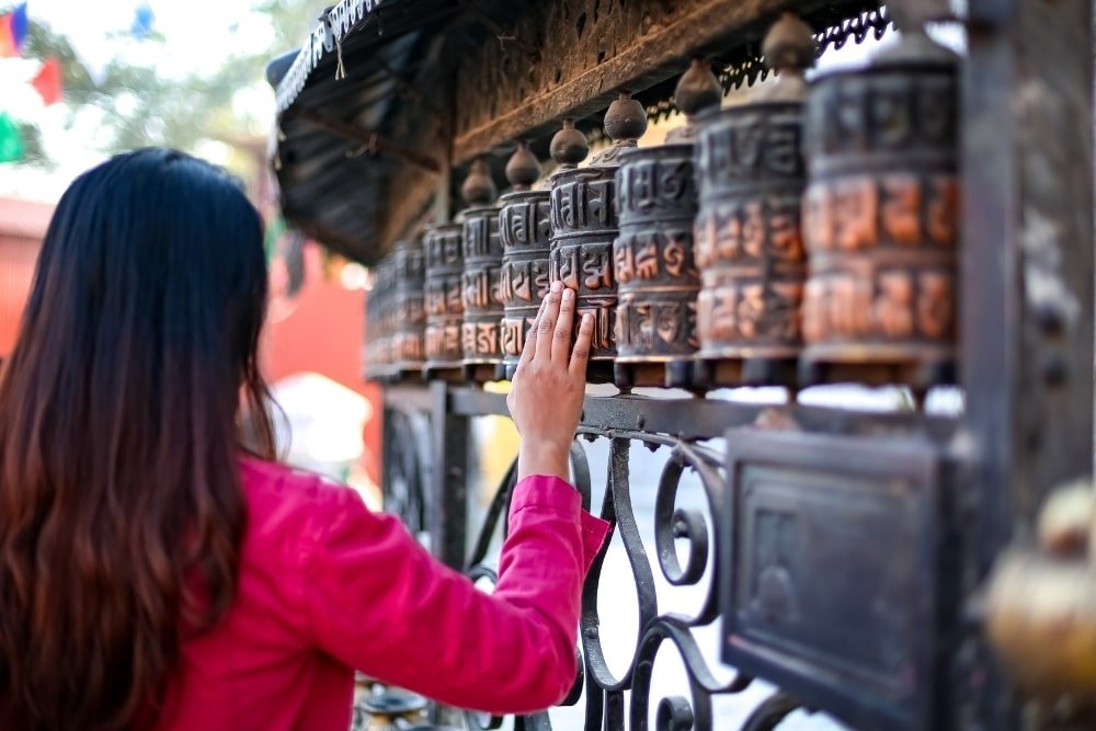 a girl doing a Buddhist ritual