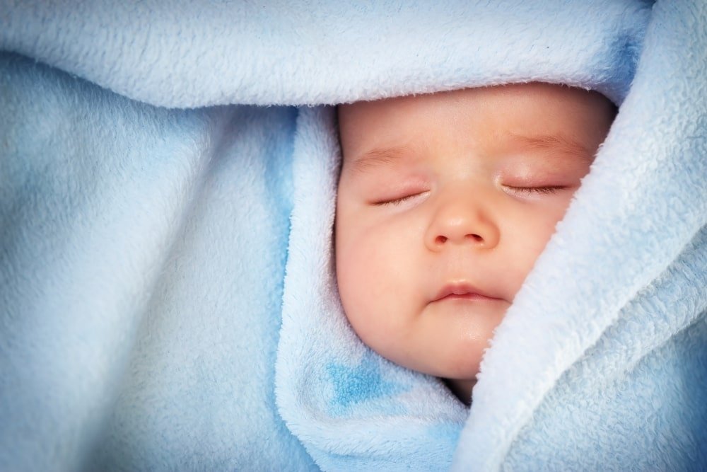 baby in blue towel