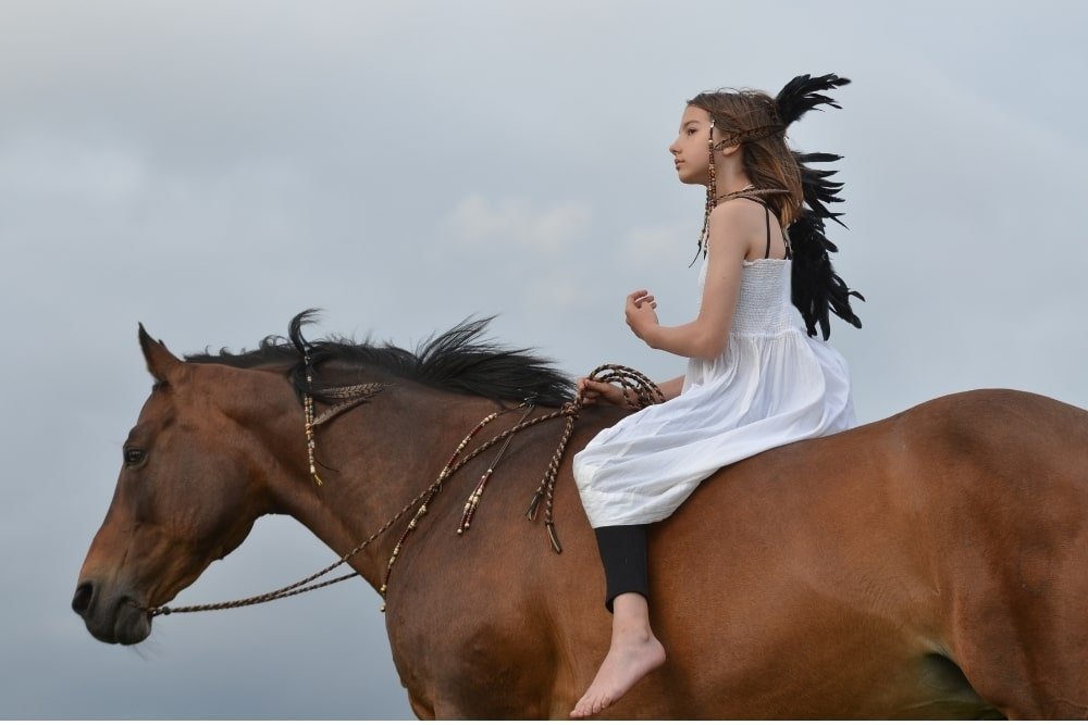 native american girl on a horse