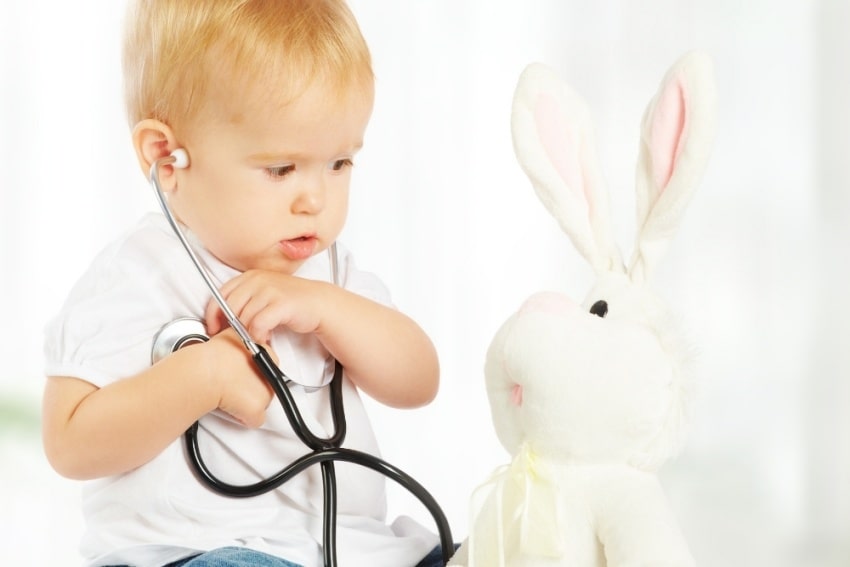 baby holding a stethoscope