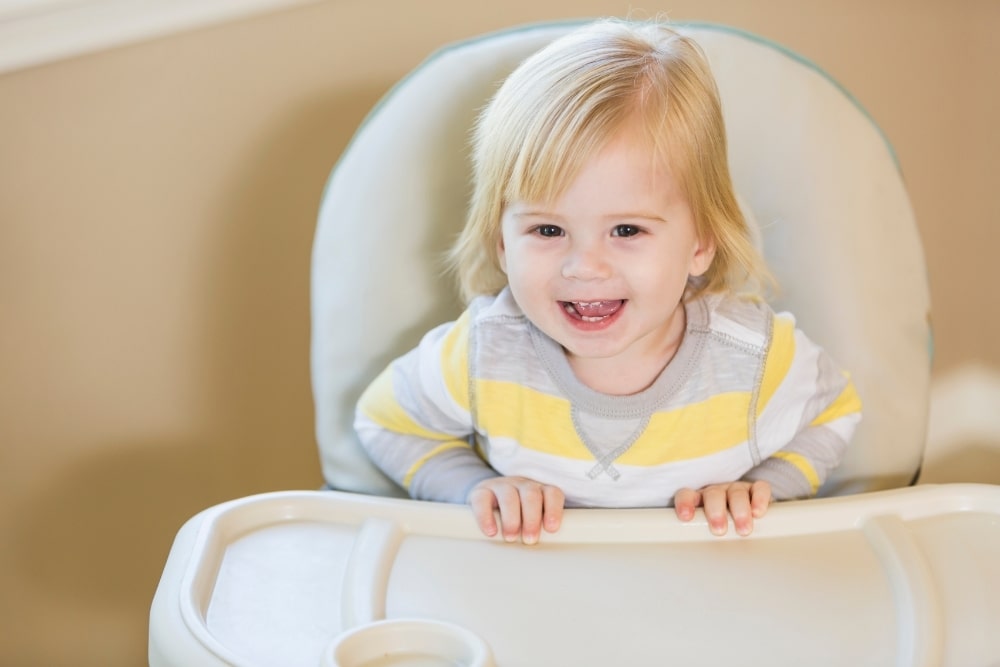 happy baby on a high chair