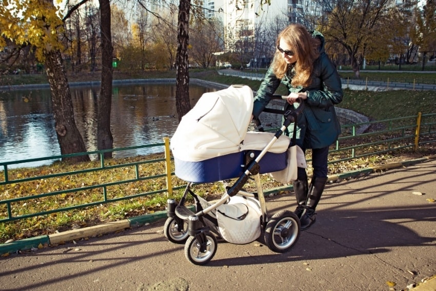 mother and baby stroller in a park