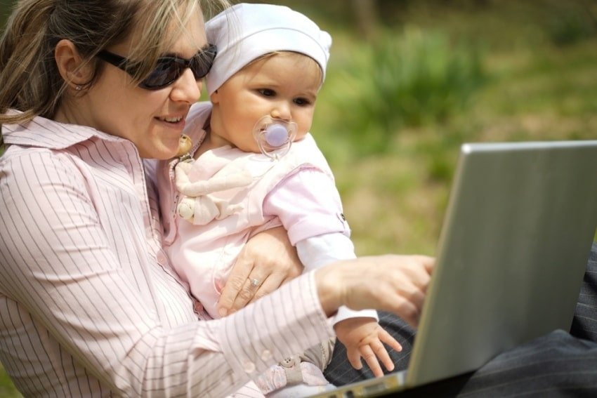 mother and baby using a laptop