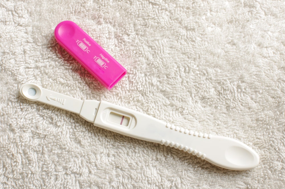 Negative pregnancy test on the white towel