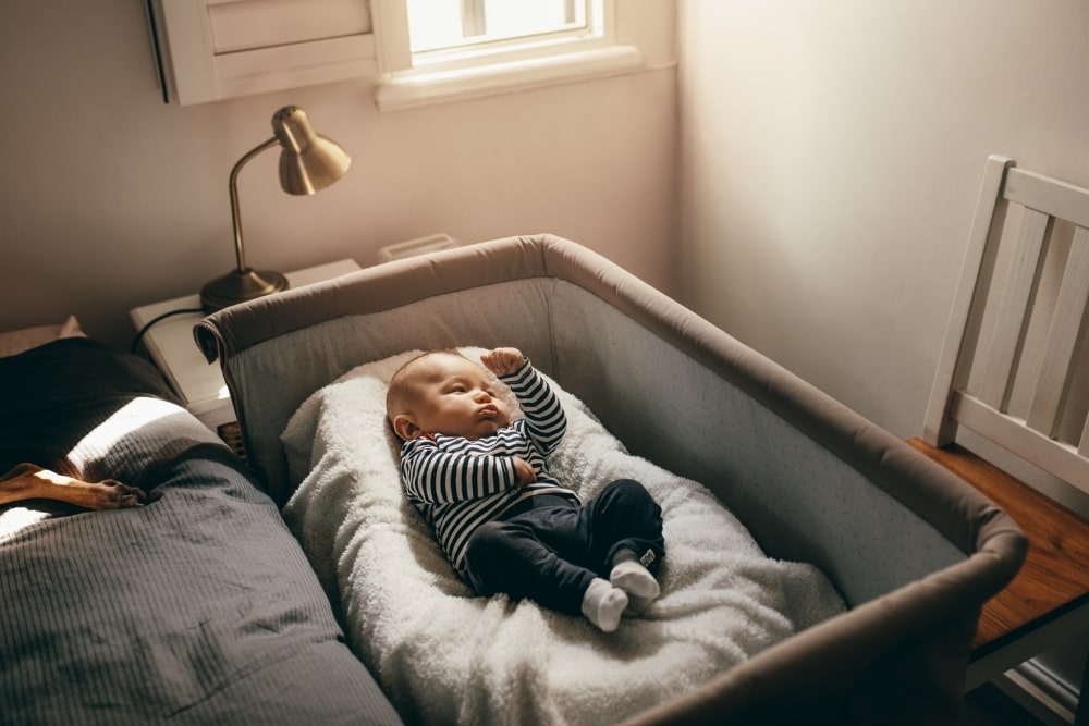 baby in a bassinet cosleeper