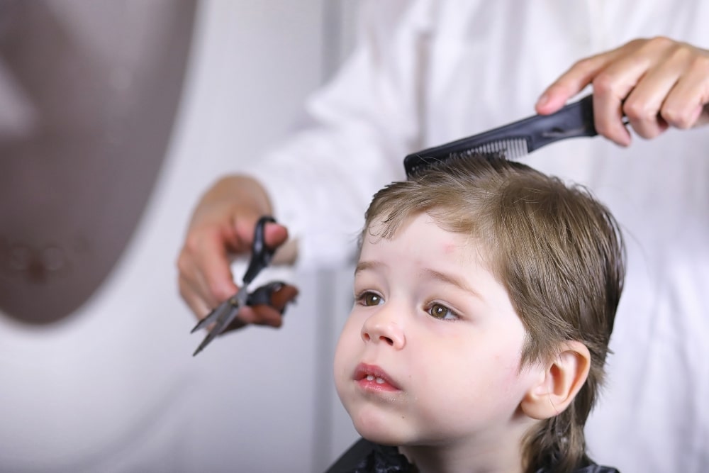 boy having a hair cut