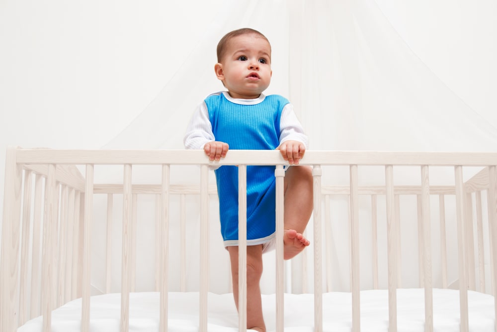 Baby climbs out of the crib