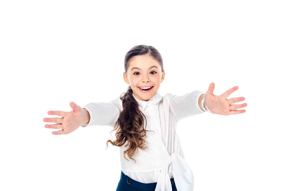 Happy schoolgirl in formal wear with outstretched hands