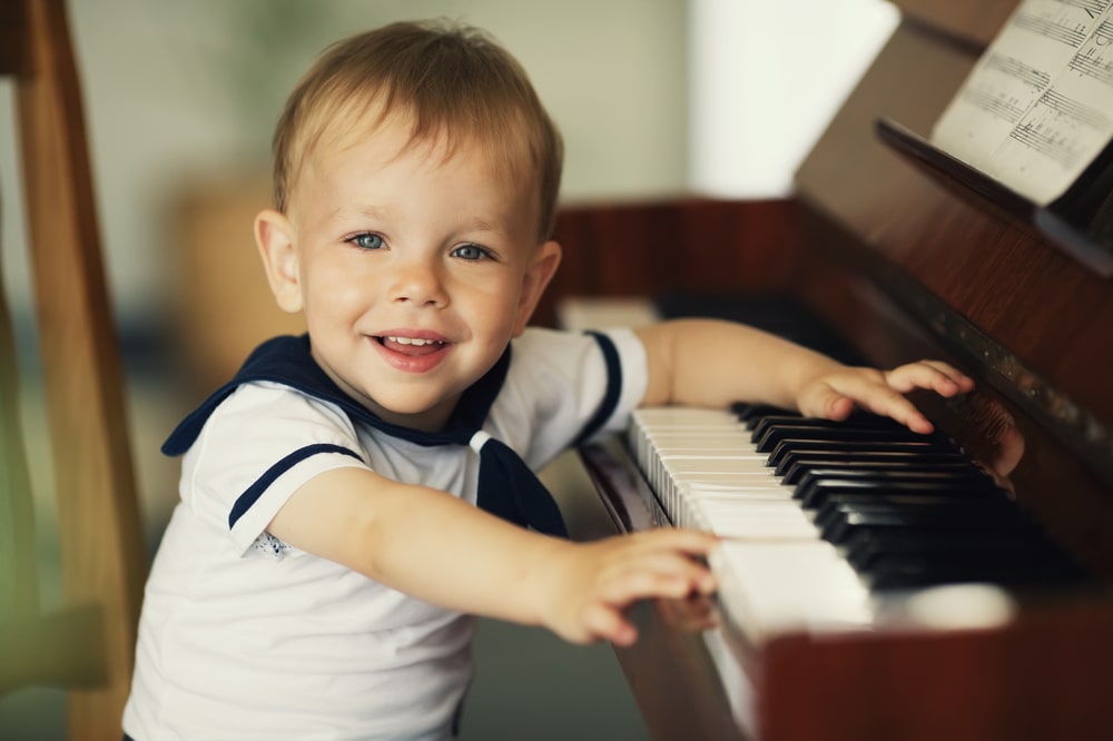 Little boy plays piano