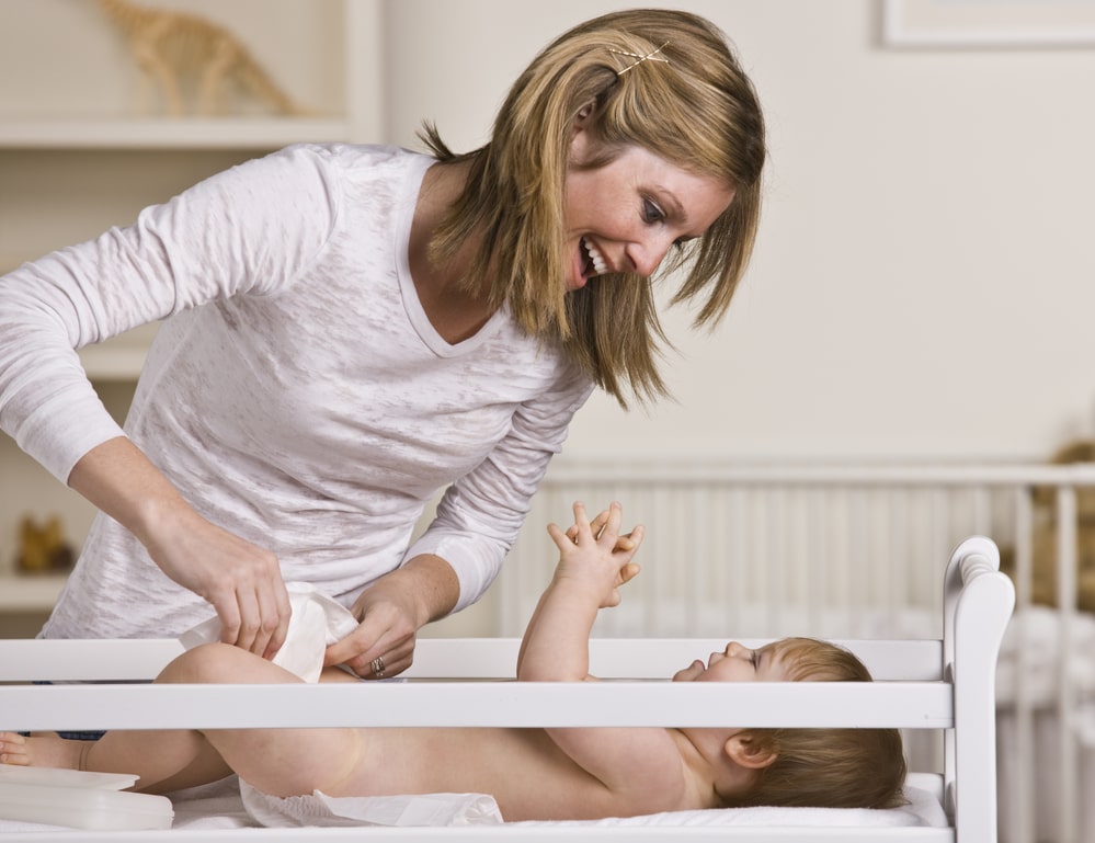 Woman Changing Baby