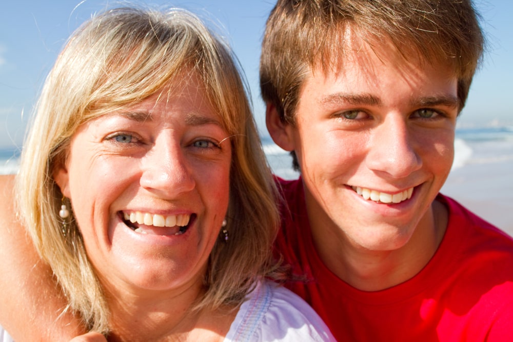 Middle aged mother and teen son portrait