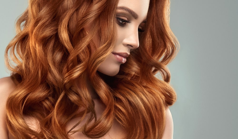 Model girl with long red curly hair