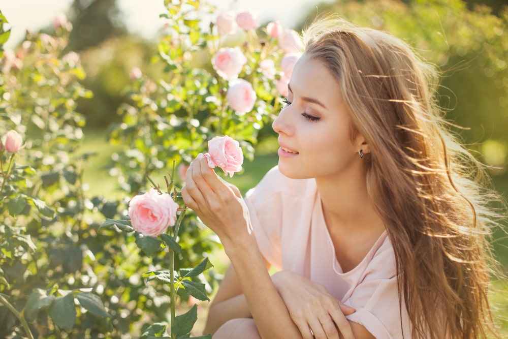Woman in a rose garden