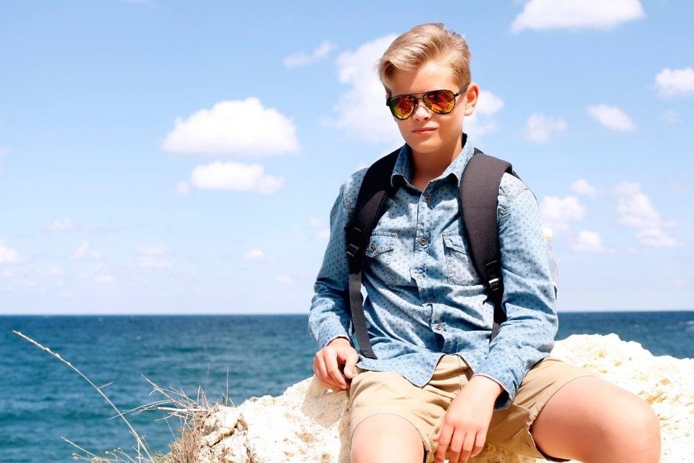 boy with a beach background