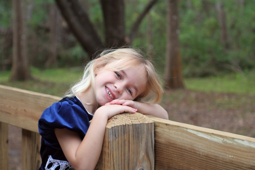 smiling little girl in blue