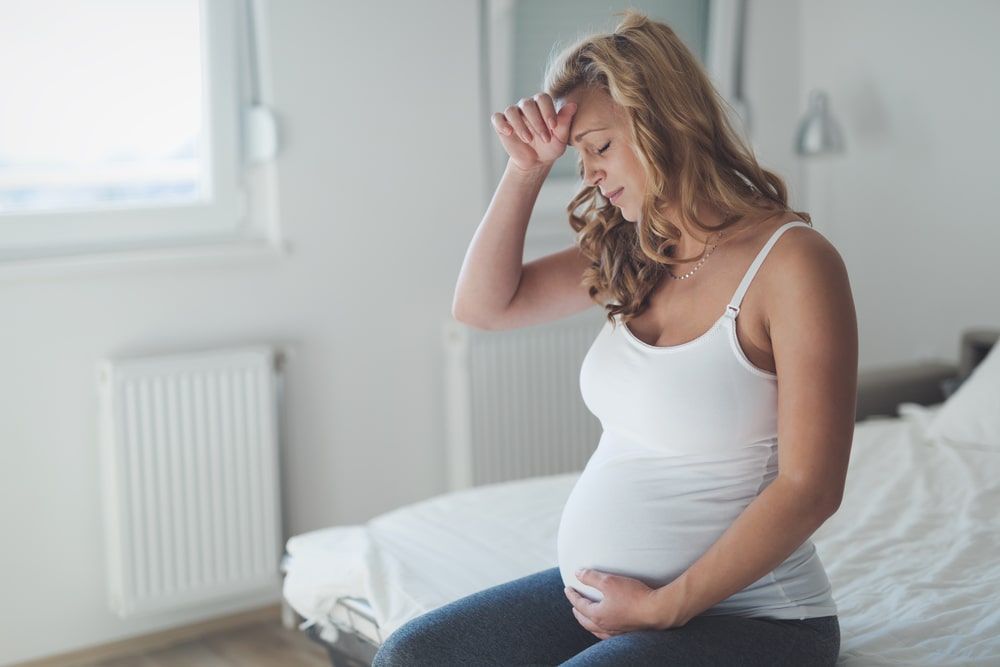 Pregnant woman suffering with headache