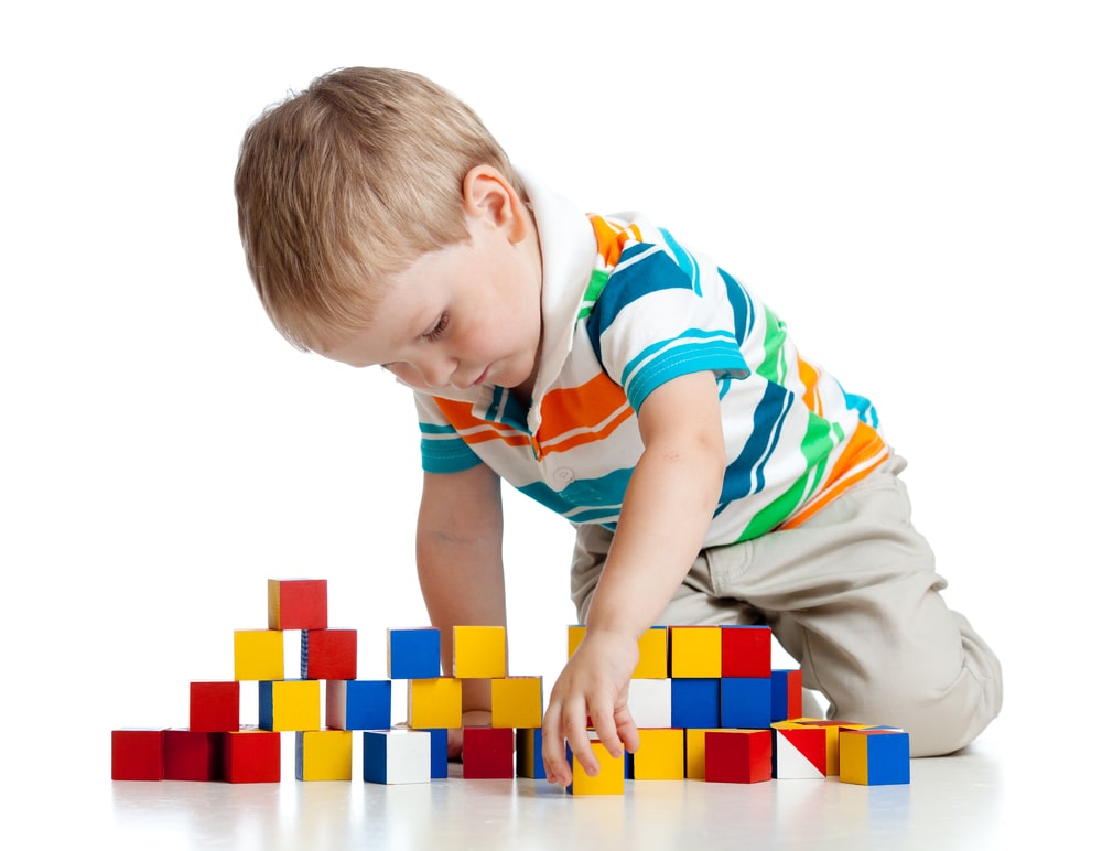 Kid playing toy blocks