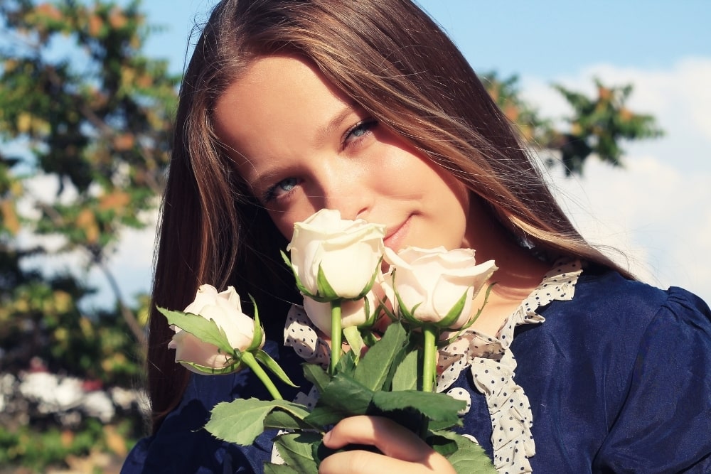 girl holding roses