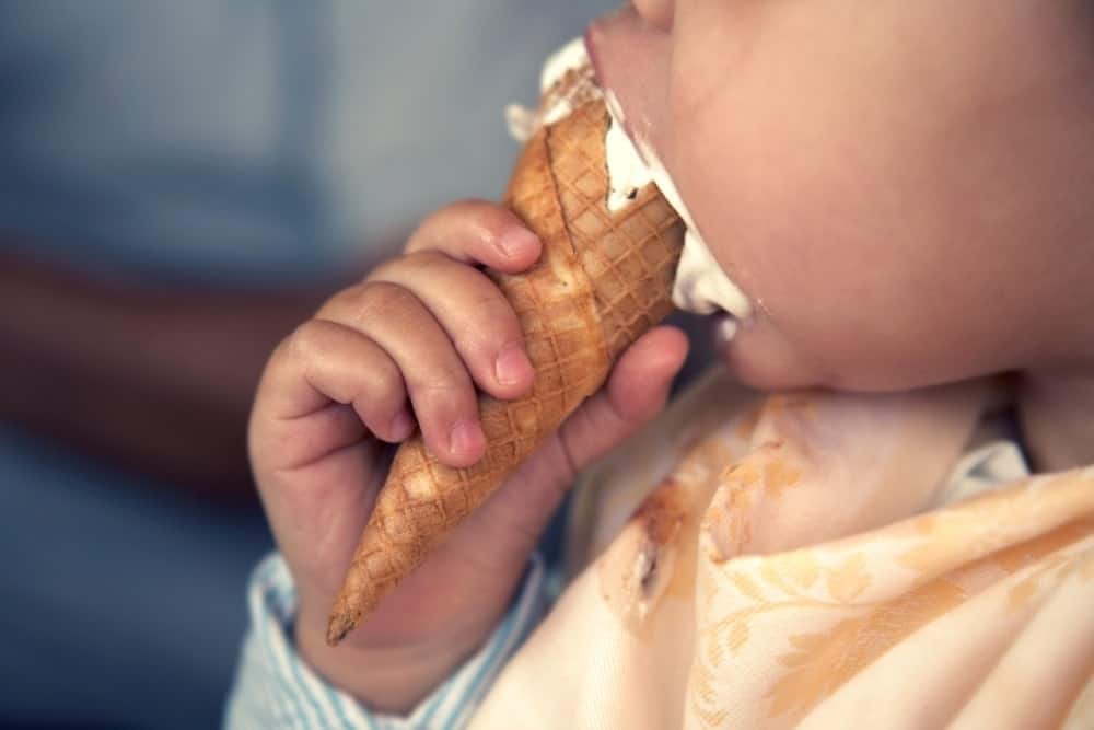 closeup child eating ice cream
