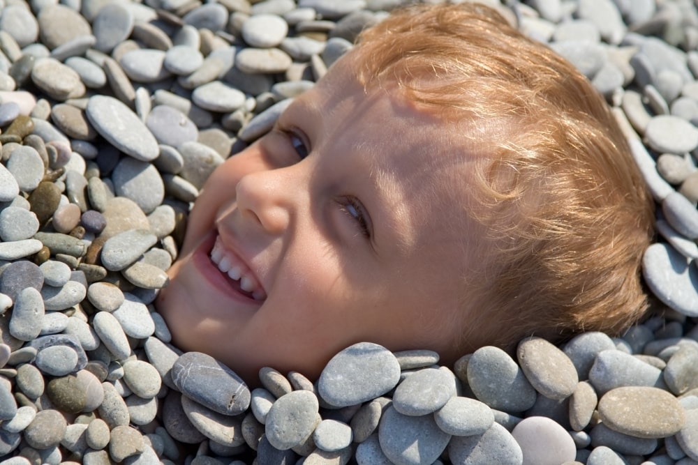 happy boy with stones