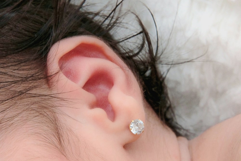 baby ears with earrings