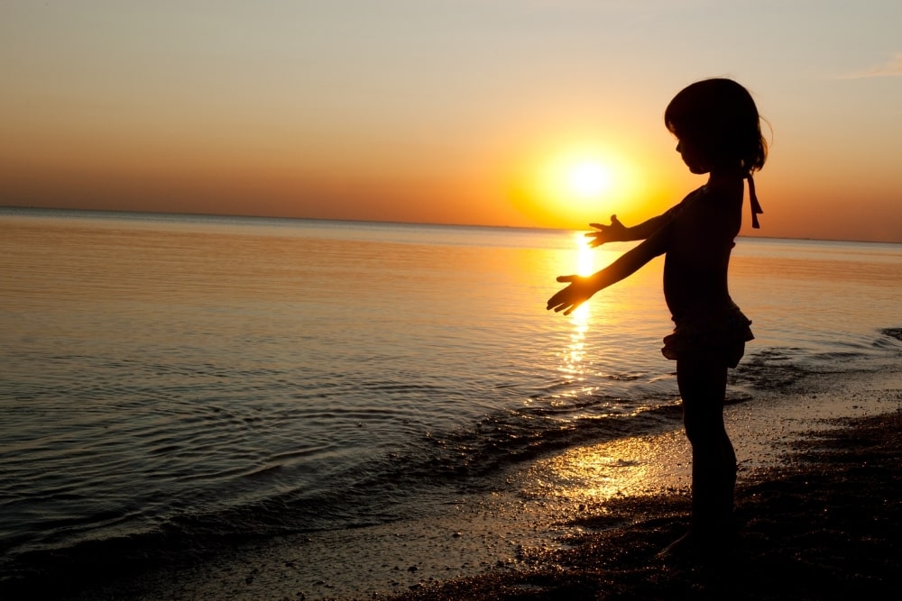 girl child silhouette sunset