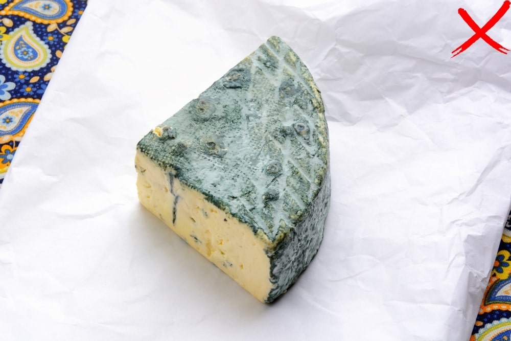 mold cheese with red x