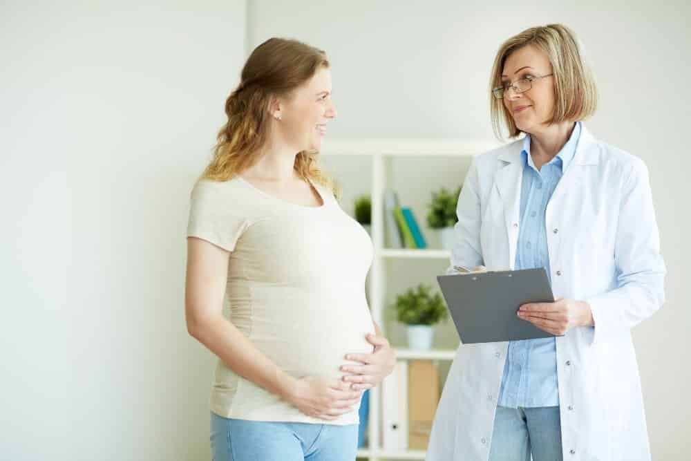pregnant talking to doctor