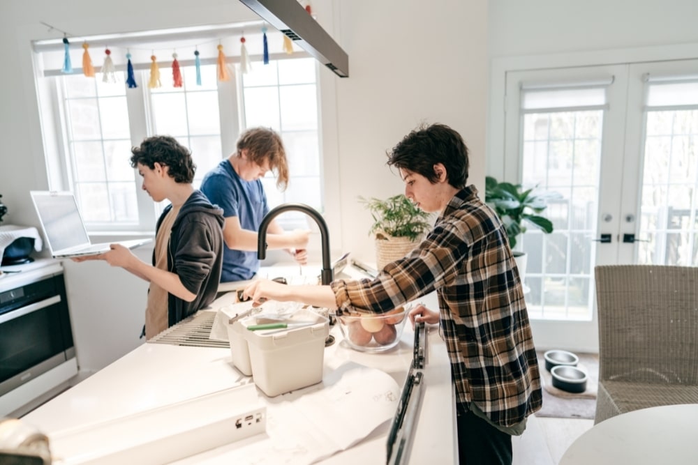 teen boy cooking house chores help