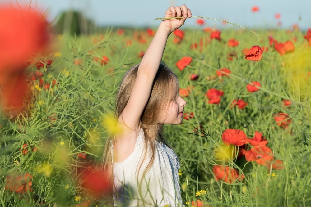 girl outdoors field of poppies1