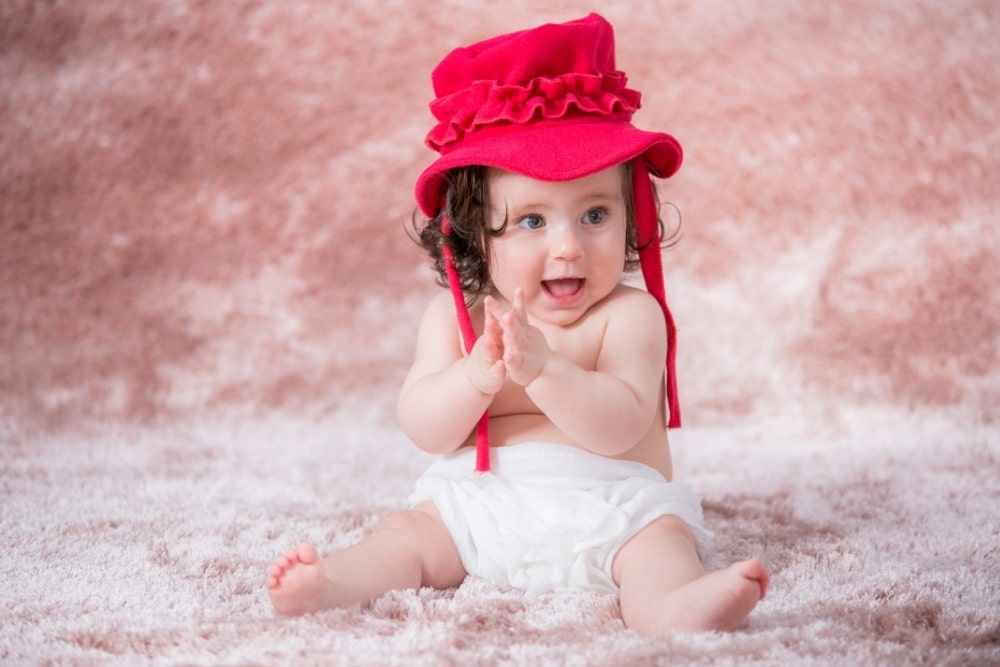 little baby girl wearing a pink hat