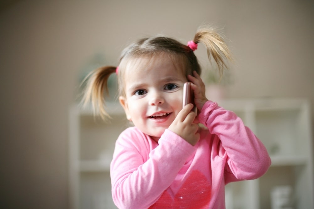 little girl smile ponytails