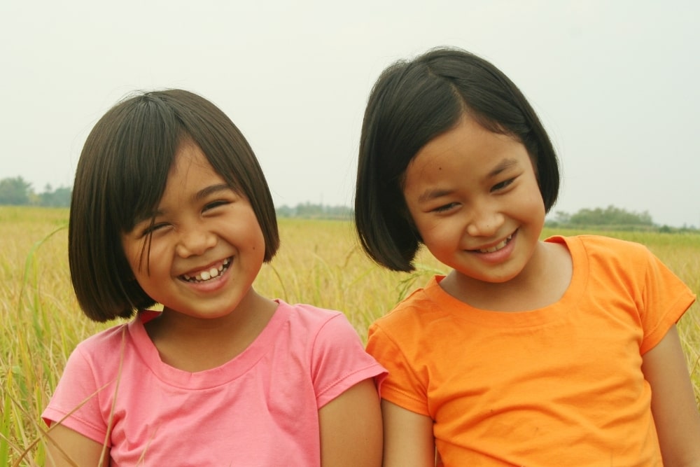little girls smile sisters