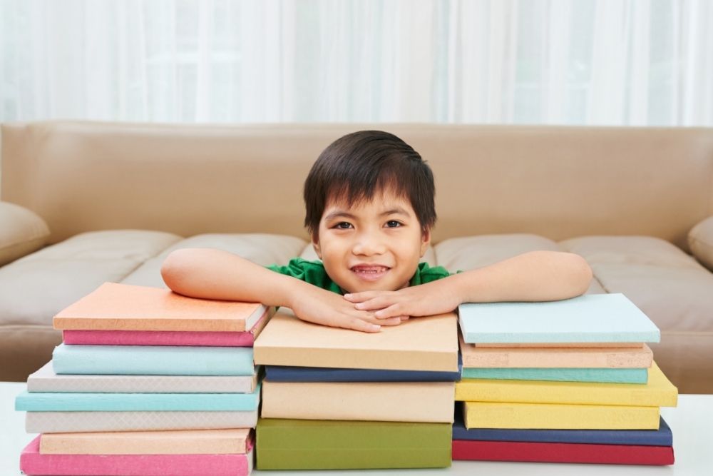 vietnamese asian boy with books
