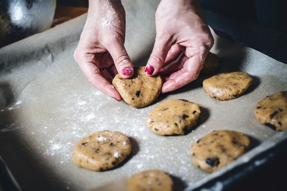 hand making cookies